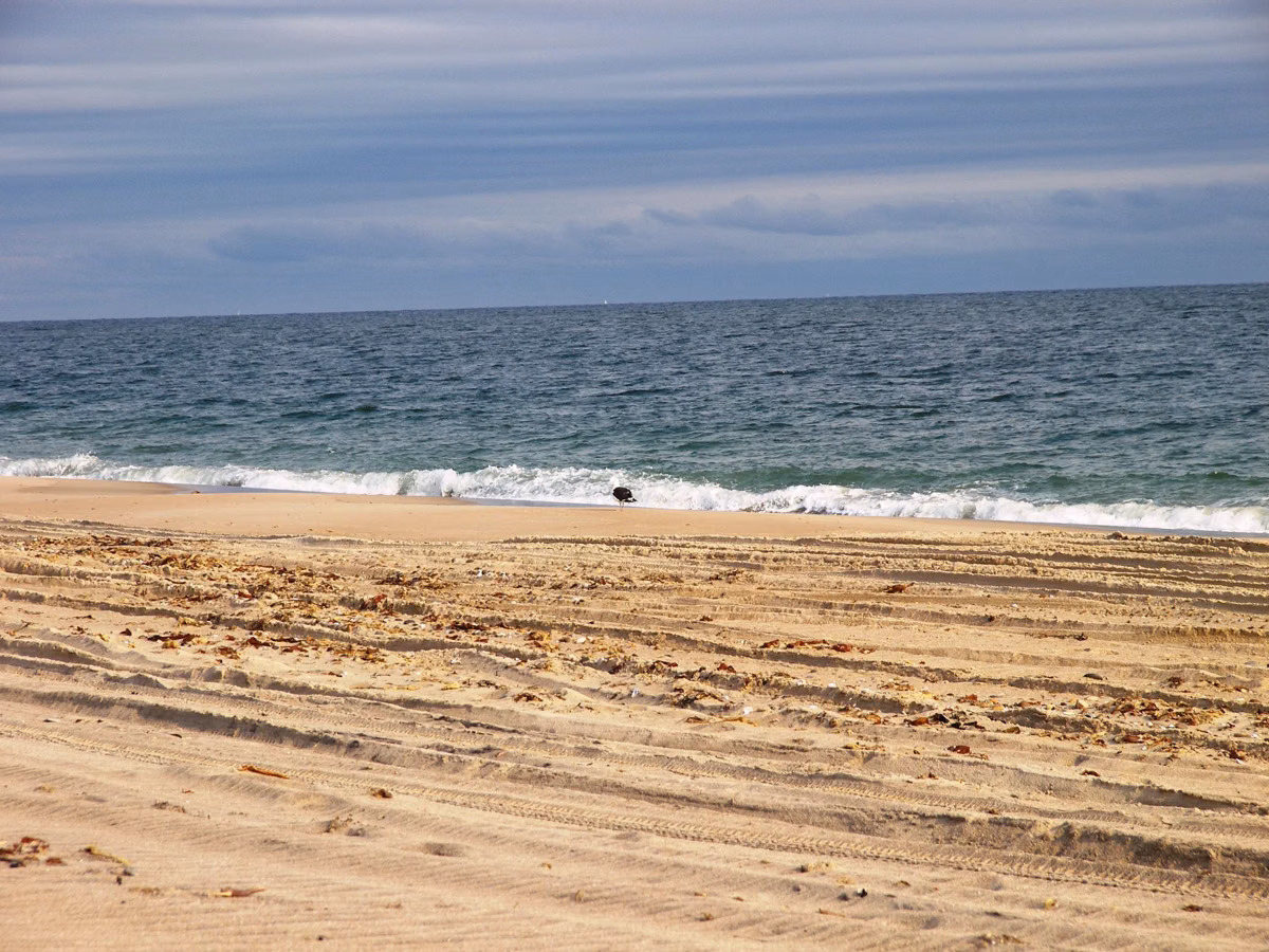 Sandy ocean beach and breaking surf in Charlestown, Rhode Island